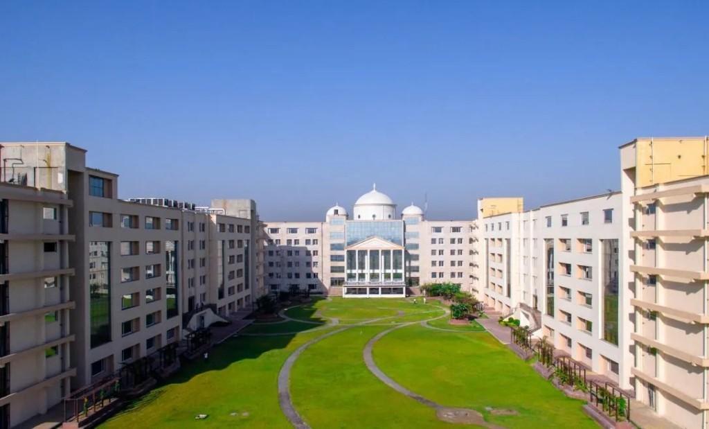 Aerial view of Zenith School of AI campus with residential blocks around a central courtyard